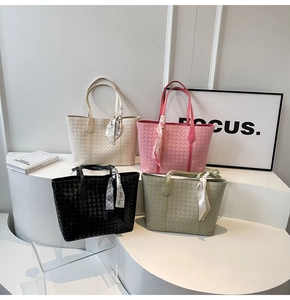 Detailed woven tote bags in four colors with decorative silk scarves and premium texture