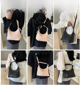 Detailed views of sparkly glitter crossbody handbag in pink and black on model