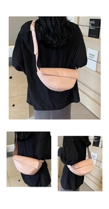 Detail view of pink wrinkled leather dumpling bag with adjustable golden buckle