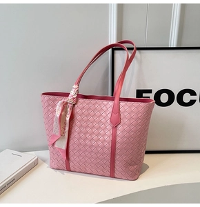 Close-up of pink woven tote bag details featuring elegant libertè printed silk scarf