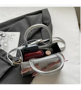 Silver crocodile pattern tote interior showing space for phone and wallet details