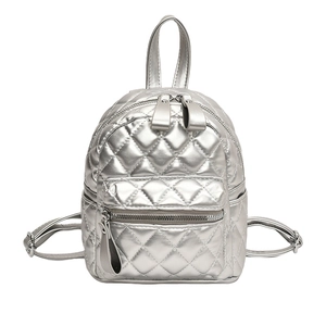 Silver quilted mini backpack for women featuring metallic finish and diamond stitching