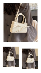 Detail of cream tote bag with three 3D bows and textured woven surface finish
