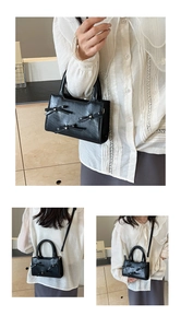 Detailed views of black butterfly tote bag with bow accents and versatile straps