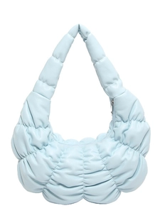 Light blue quilted puffy shoulder bag with ruched texture and minimalist crescent shape