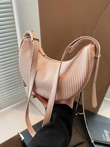 Pale pink pleated crescent handbag with adjustable strap and golden hardware