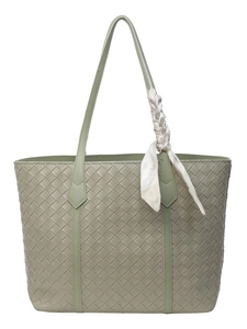 Light green woven tote bag with diamond texture and elegant silk scarf detail
