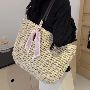 Large capacity woven straw tote bag with brown leather straps and pink heart scarf detail