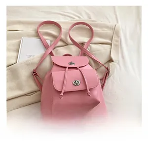 Pink PU leather backpack featuring drawstring closure and stylish metal twist lock details