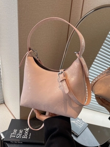 Pink metallic moon hobo bag with shimmering coating and adjustable shoulder strap