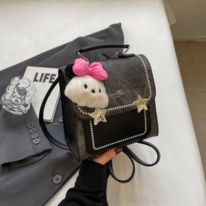 Versatile black patchwork backpack with pearl trim and star accents for women
