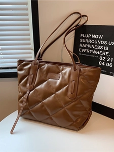 Brown quilted tote bag with large capacity and elegant leather finish for daily commute