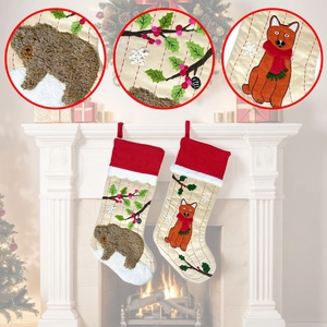 Detail of Christmas stockings with 3D bear and fox embroidery on cream satin fabric
