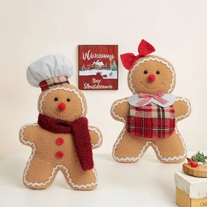 Detail of plush gingerbread man set with chef hat and red bow in a festive scene