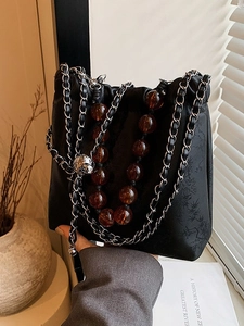 Chinese style black satin bucket bag with floral embroidery and amber beaded chain strap
