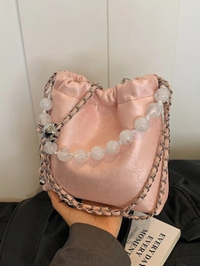 Pink drawstring bucket bag with floral patterns and pearl chain strap for women