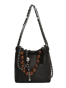 Chic black drawstring bucket bag with amber beads and vintage floral patterns