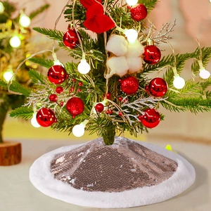 Detail view of champagne gold sequin Christmas tree skirt with white faux fur plush border