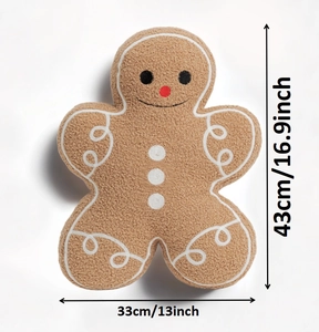 Detailed view of plush gingerbread man pillow with size markers 43cm and 33cm
