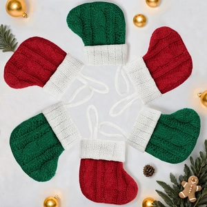 Mini knitted Christmas stockings in red and green for tree decor and gift bags