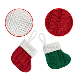 Detailed macro view of cable knit textures on red and green Christmas mini stockings