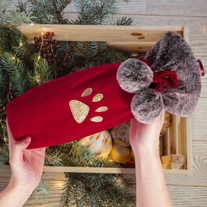 Christmas plush wine bottle cover with red velvet texture, gold paw print and fur trim