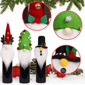 Detailed view of handmade Christmas wine bottle covers with felt hats and plush beards