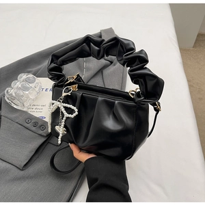 Chic black pleated PU handbag with pearl bow charm and ruffled handle for 2024 spring