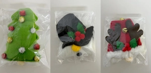Detail of Christmas gnome wine bottle covers with reindeer antlers and festive bells