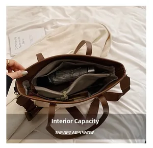 Detaillierte Innenansicht eines großen Kontrast-Tote-Bags mit Taschen und viel Stauraum