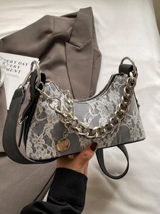 Elegant white floral lace underarm bag with thick silver chain and black leather strap