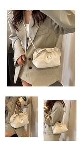 Detail of pleated cloud bag featuring silver butterfly clasp and woven chain strap
