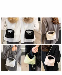 Selection of pleated chain handbags in six colors shown with lifestyle modeling