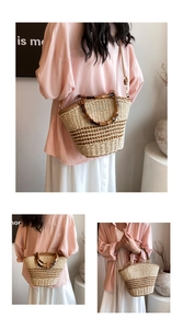Detail of straw bucket bag featuring bamboo handles and brown woven stripe base