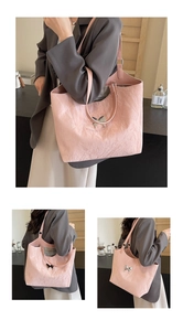 Detail view of pink tote bag featuring unique pleated texture and metal bow hardware