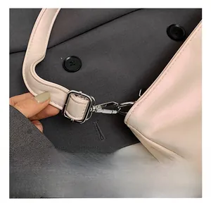Close-up of premium silver metal hooks and adjustable strap on a pink ballet bag
