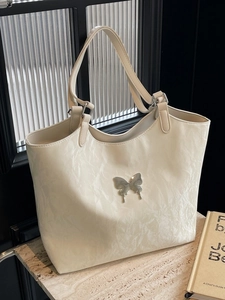 Chic beige tote bag with pleated texture and silver butterfly buckle for women