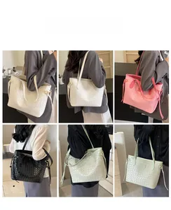 Close-up of woven tote bag textures and colors in white, pink, black, and green