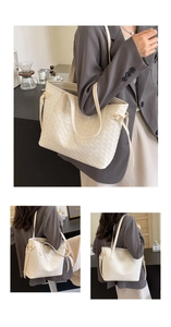 Detail of a large cream woven tote bag with quilted texture and gold metal buckle