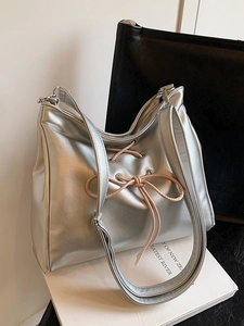 Silver metallic ballet-style shoulder bag with pink bow ribbon and large capacity
