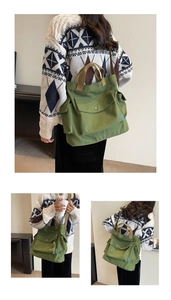 Detail of green canvas tote bag featuring multiple cargo pockets and brown webbing straps