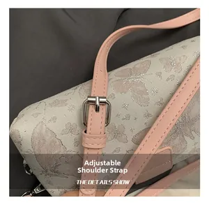 Detail of adjustable pink PU leather shoulder strap with silver buckle on butterfly bag