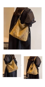 Detail der großen Canvas-Tasche mit strukturierter Textur und Metall-D-Ring-Verzierung