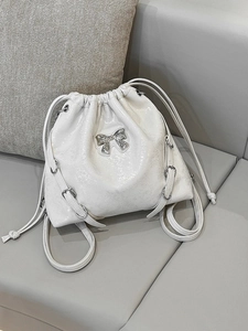 Elegant pearl white drawstring bucket backpack with silver metallic bow and chain strap