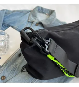 Close-up of black nylon bag durable hook with a neon green woven decorative cord