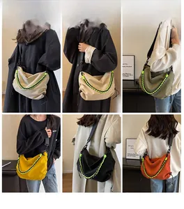 Detail view of nylon crossbody dumpling bags with decorative neon woven ropes in multiple colors