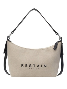Sac hobo en toile beige avec bandoulière noire et fermeture éclair minimaliste