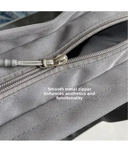 Close-up of durable Oxford cloth texture and smooth metal zipper with pull cord detail