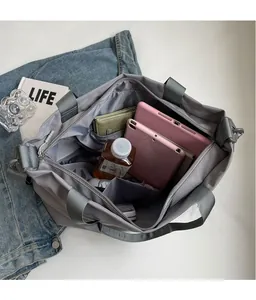 Interior view of grey Oxford fabric tote bag showing spacious compartments and storage capacity