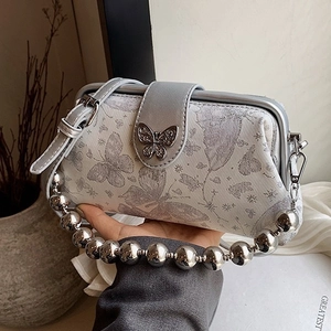 Vintage silver butterfly crossbody bag with metallic ball handle and floral embroidery